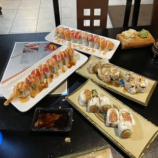 a variety of sushi dishes on a table
