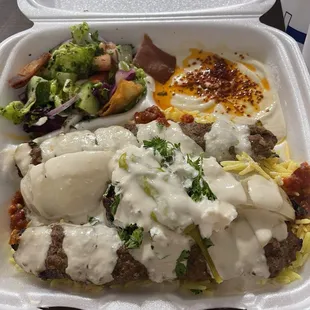 Salad hummus and beef kebab bowl.