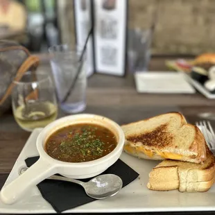 a bowl of soup and a sandwich
