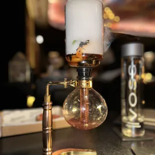 a lit candle on a table