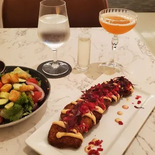 House side salad, fried green tomatoes, and Yellow Submarine (Proseco + cocktail) drink.