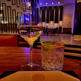 a glass of wine and a drink