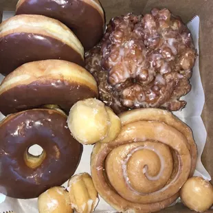 Chocolate donuts, apple fritters, cinnamon roll