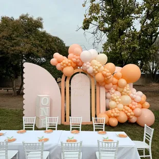 backdrops with balloons and kids tables and chairs