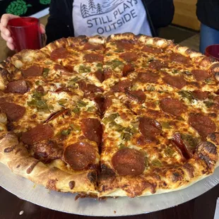 Pepperoni with hatch green chilies and Spicy red sauce