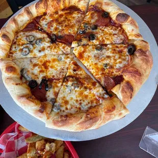 12" pepperoni with black olives, spicy marinara, and roasted garlic!