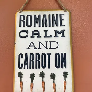 a sign hanging on a wall