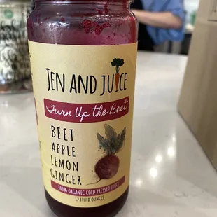 a jar of beet, apple, and lemon juice