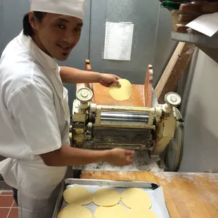Chef Teng is preparing the dough for the tart shells.