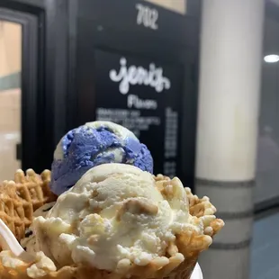 Salted peanut butter with chocolate flecks, brown butter almond brittle, rocket pop trio in waffle bowl