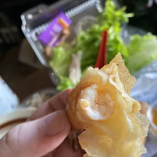 Long black hair wrapped around my shrimp roll.