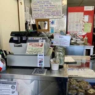 a counter with a sign on it