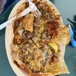 Horribly dry (without any Guacamole or cream) and undercooked raw chorizo meat..