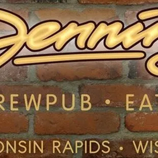 a brick wall with the name of the restaurant