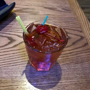 a drink in a glass on a table