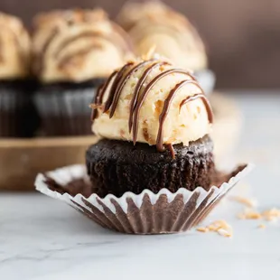 a chocolate cupcake with a bite taken out of it