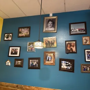 a wall of family photos