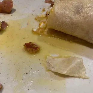 Oil drenched ham and egg burrito