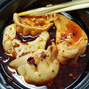 Close up of my special request! Dumplings in a spicy oil sauce! So good! 2 thumbs up!