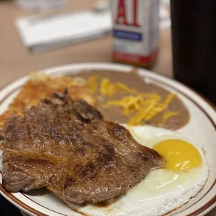 Steak and eggs with biscuit and gravy