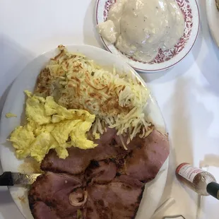 Ham steak  Eggs, hash brown and biscuits gravy yum