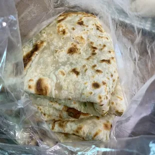 Green onion pancakes are huge. $5 gets you one the size of a medium pizza at most places with a nice chewy thickness