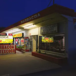 The restaurant store front in the evening