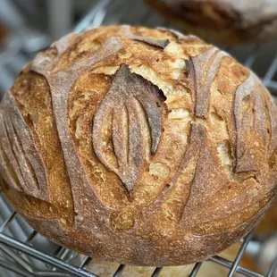 a loaf of bread on a cooling rack
