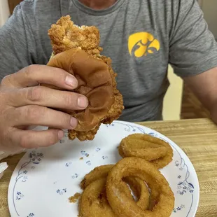 Breaded Tenderloin Sandwich plus onion rings. Yum. Gotta ask for all toppings.