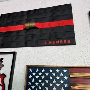 a thin red line flag on a wall