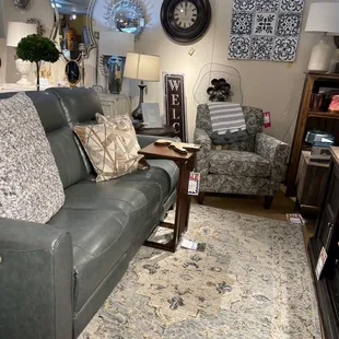 Living room set, rugs, decor.