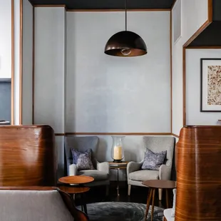 a living room with a couch, chairs, and a coffee table