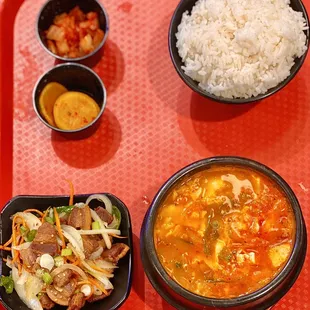 [seafood] tofu soup+bbq combo (pork belly): comes w 1 bowl white rice (not pictured) &amp; banchan (yellow radish, kimchi) (08/2022)