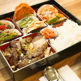 a bento box of food