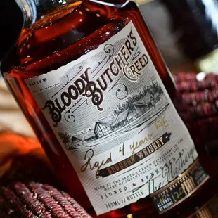 a bottle of booze on a table