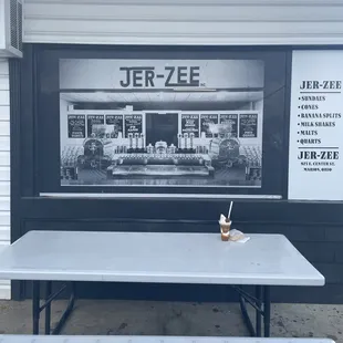 ows a picnic table and bench