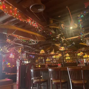 a bar decorated with christmas lights