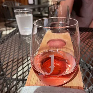 a glass of wine on a table