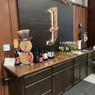 a bar with bottles of wine on it