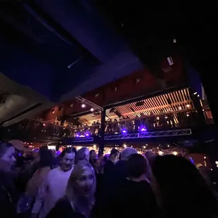 View towards sold out crowd &amp; balcony from floor by stage