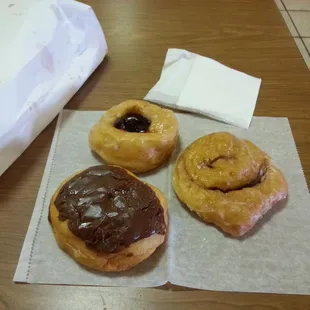 Strawberry filled, cinnamon roll and a eclair donuts.  All great, wish I could eat one of every donut they make.
