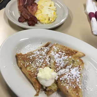 a plate of french toast and bacon
