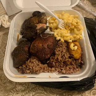 a tray of food with macaroni and cheese