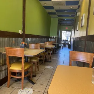 empty tables and chairs in a restaurant