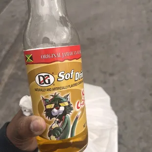 a person holding a bottle of beer