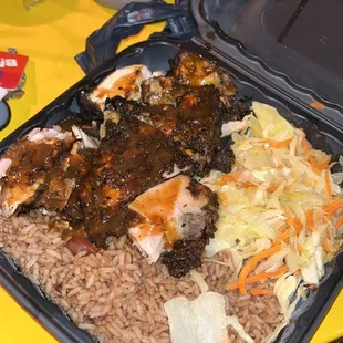 Jerk chicken cabbage and rice and peas
