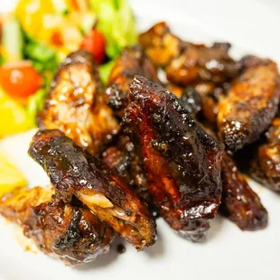 a plate of meat and vegetables