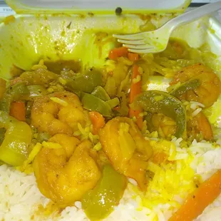 a plate of food with rice and vegetables