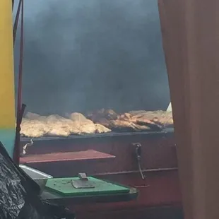 Jerk chicken being cooked at Downtown Food Truck Rodeo