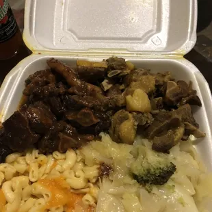 Oxtails, Curry Goat, mac n cheese and vegetables. All good.